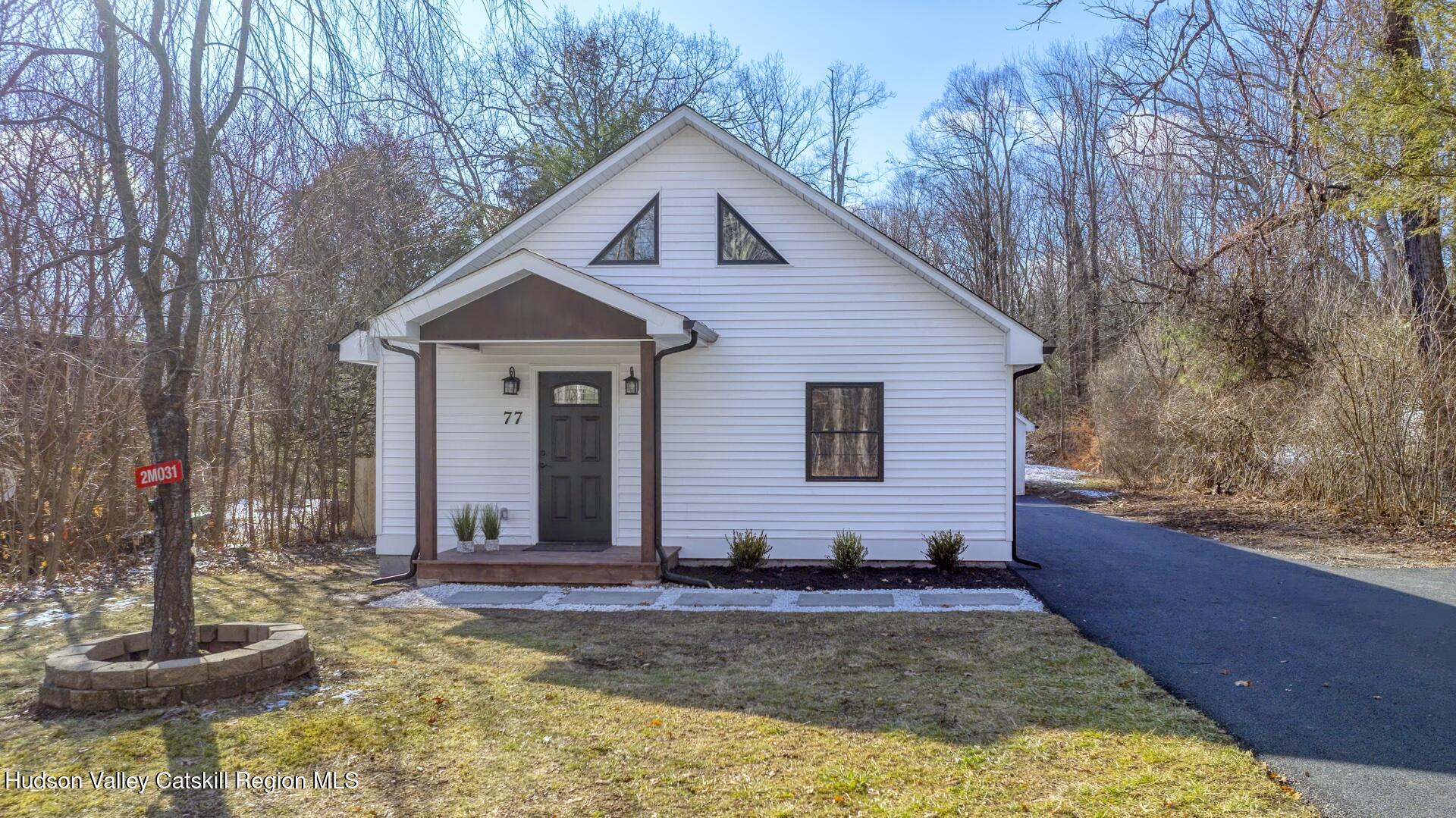 a front view of a house with entertaining space