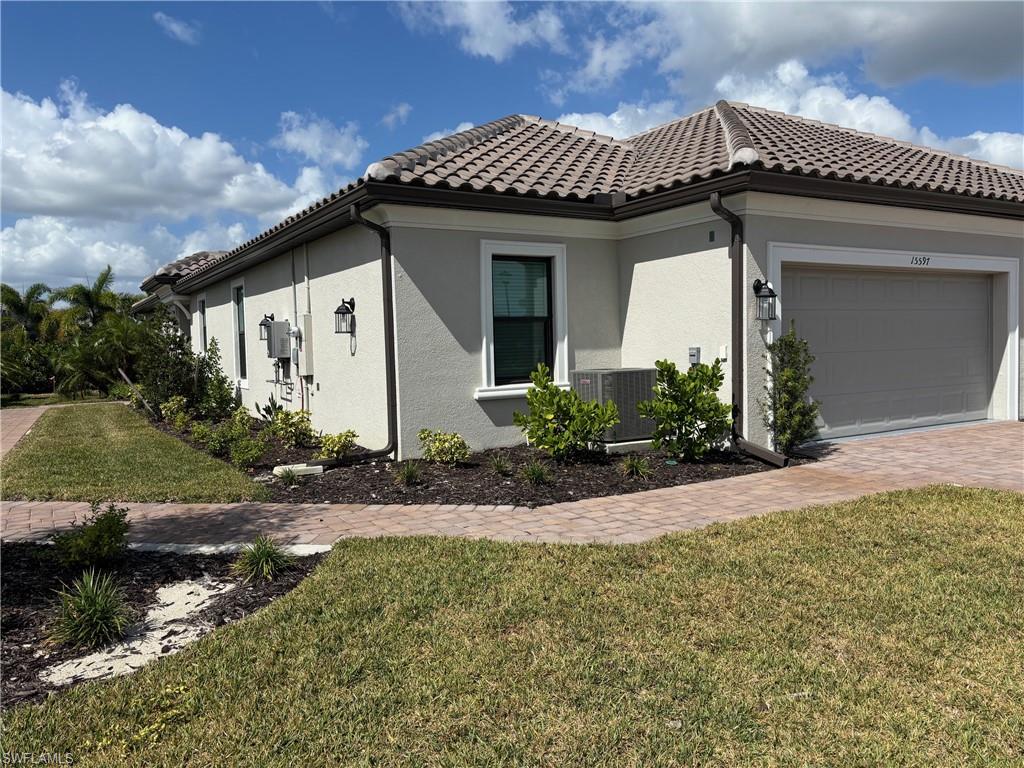 a front view of a house with garden