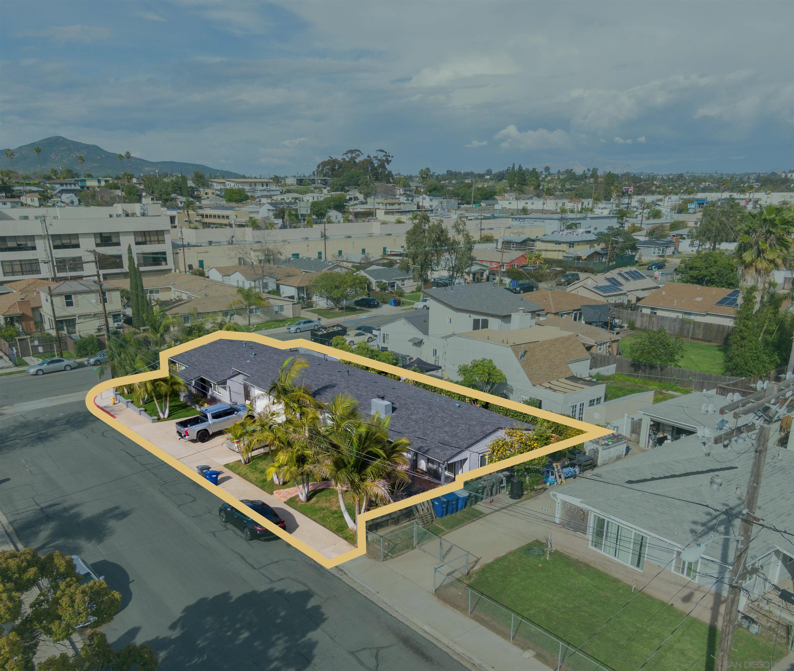 an aerial view of a house with a ocean view