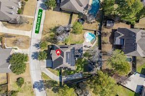 an aerial view of house with yard