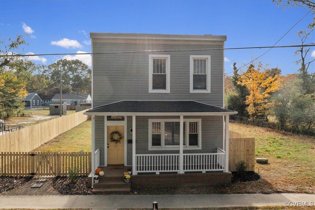 View of property with a porch