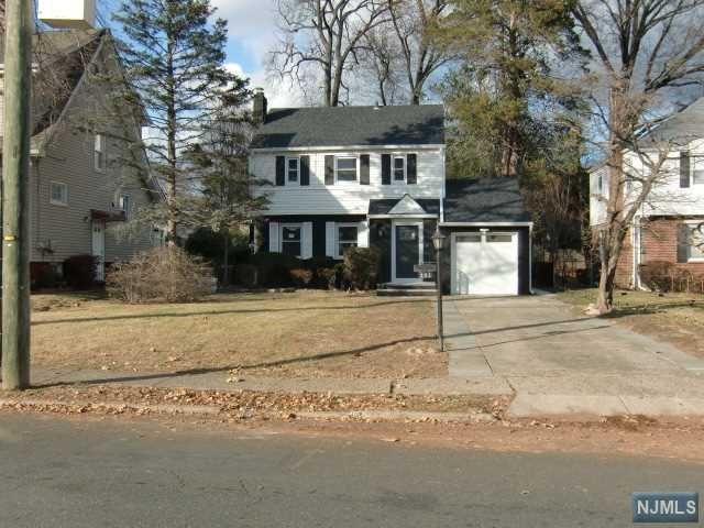 a front view of a house with street