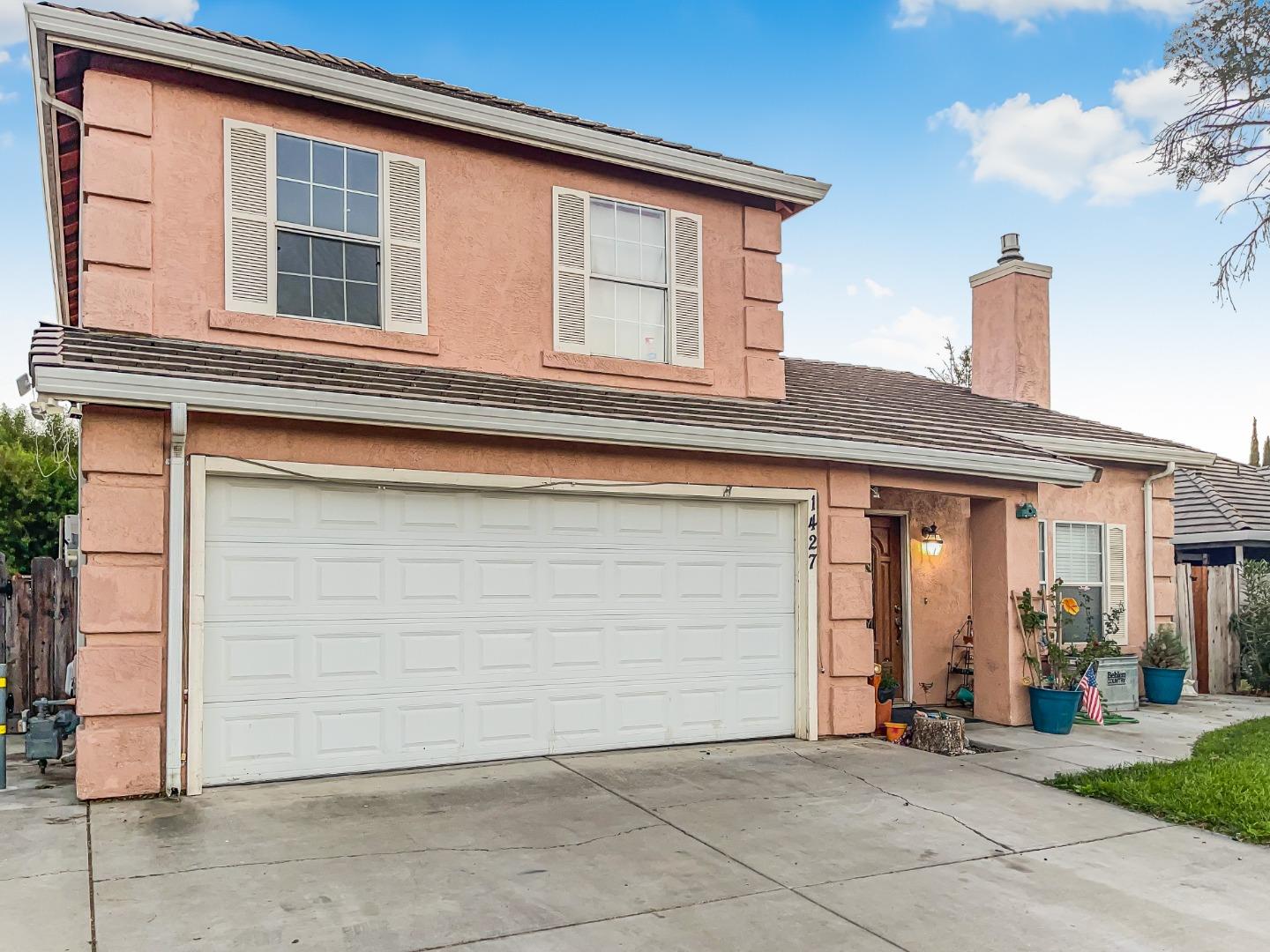 a front view of a house with garage