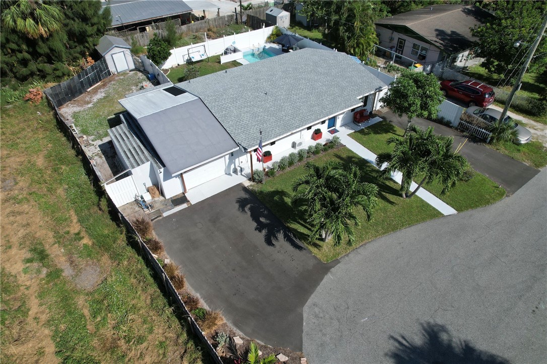 an aerial view of house with yard