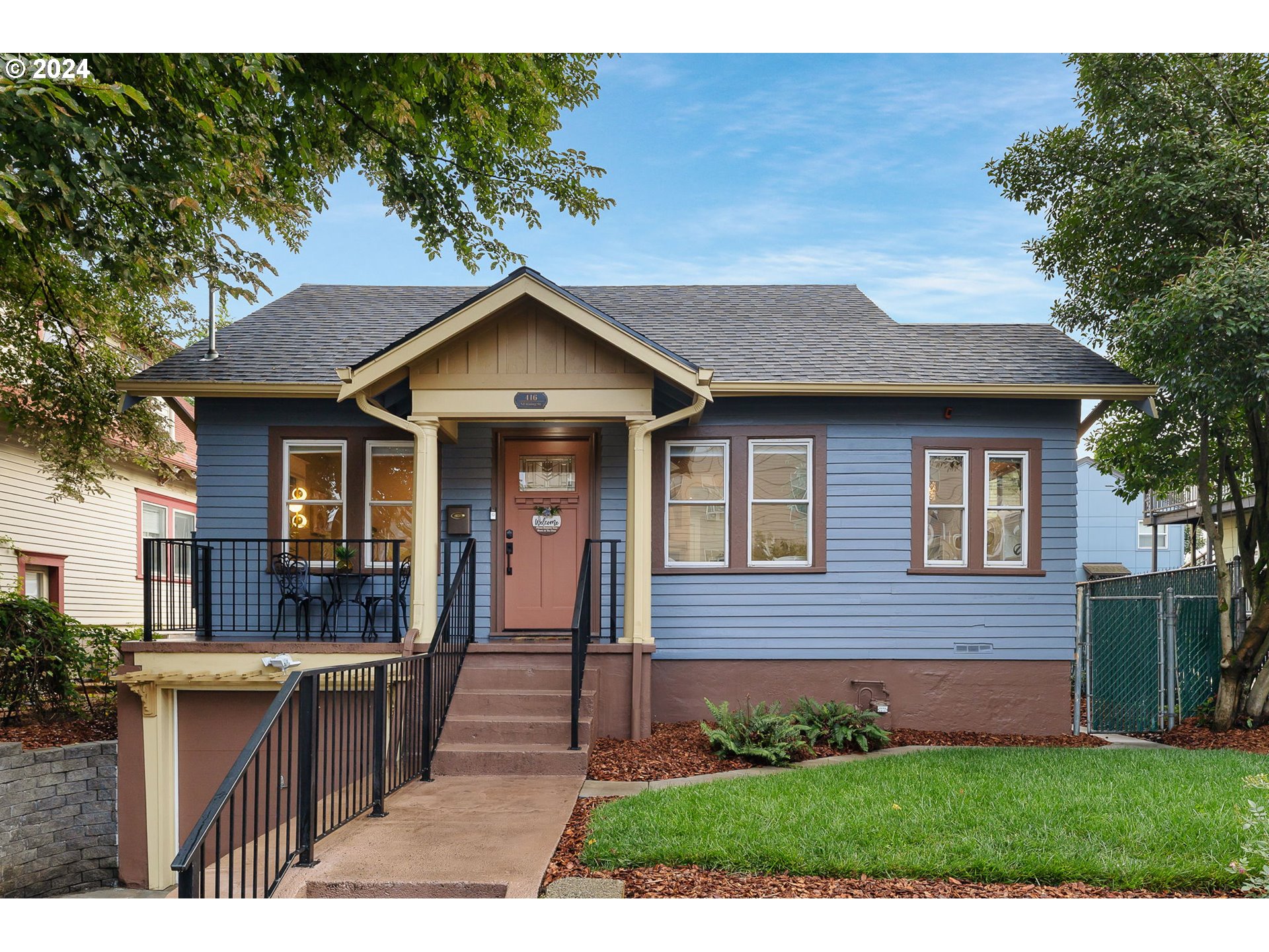 a front view of a house with a yard