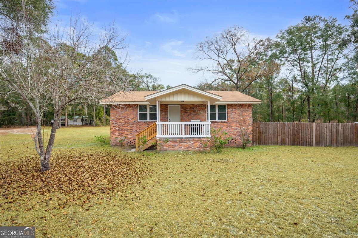 a house with trees in the background