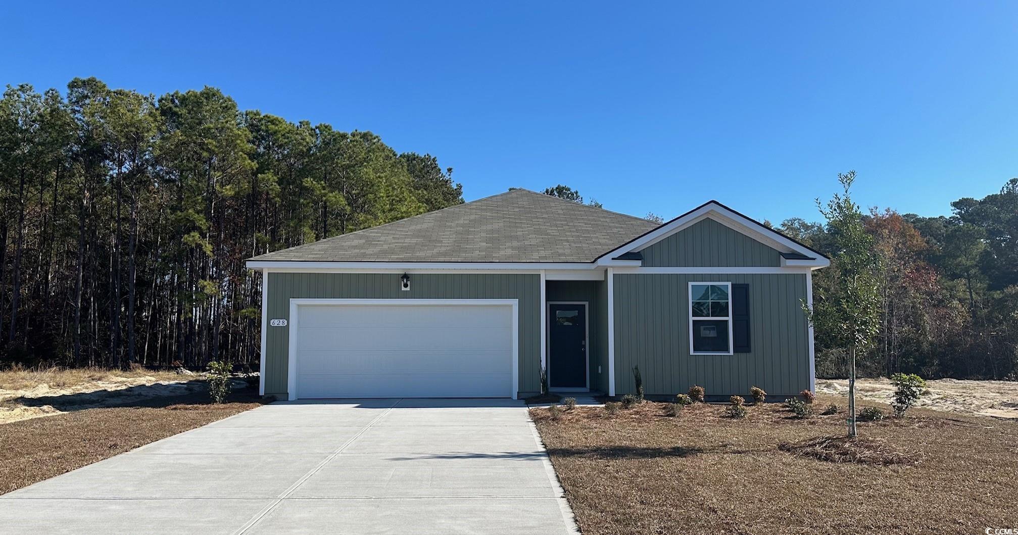 View of front of property with a garage