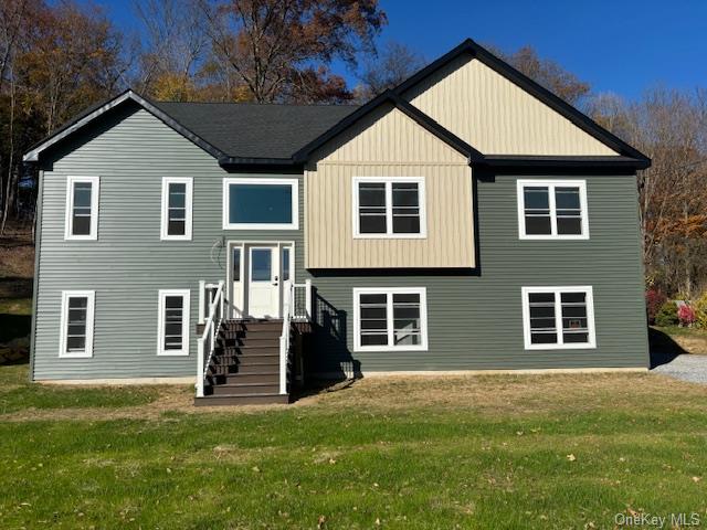 a front view of a house with a yard