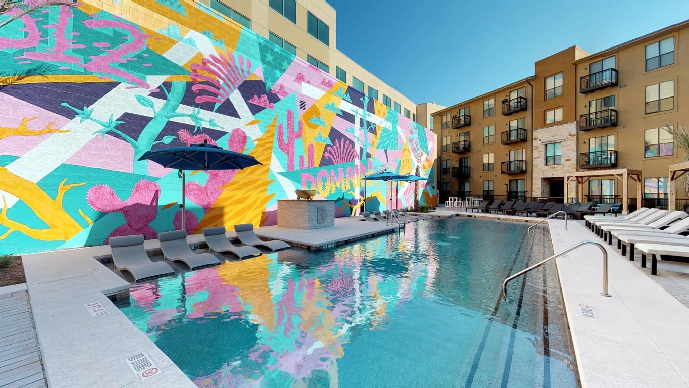 a view of swimming pool with outdoor seating