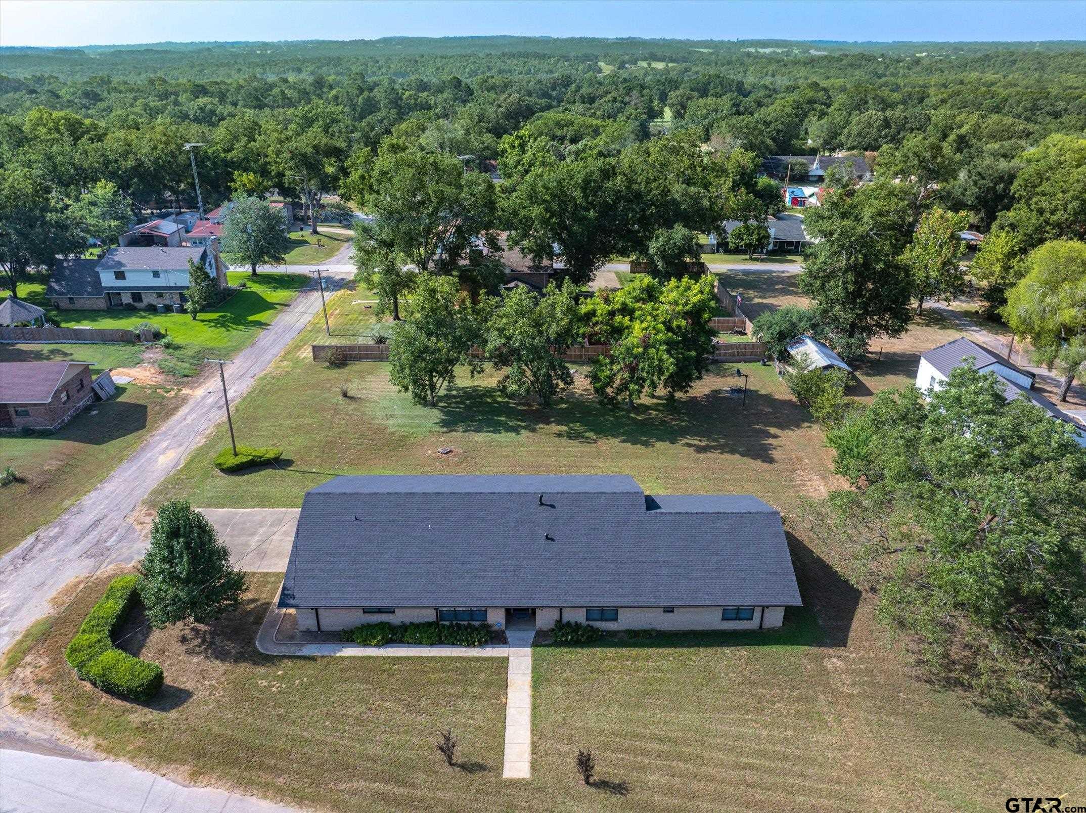 an aerial view of a house with a garden