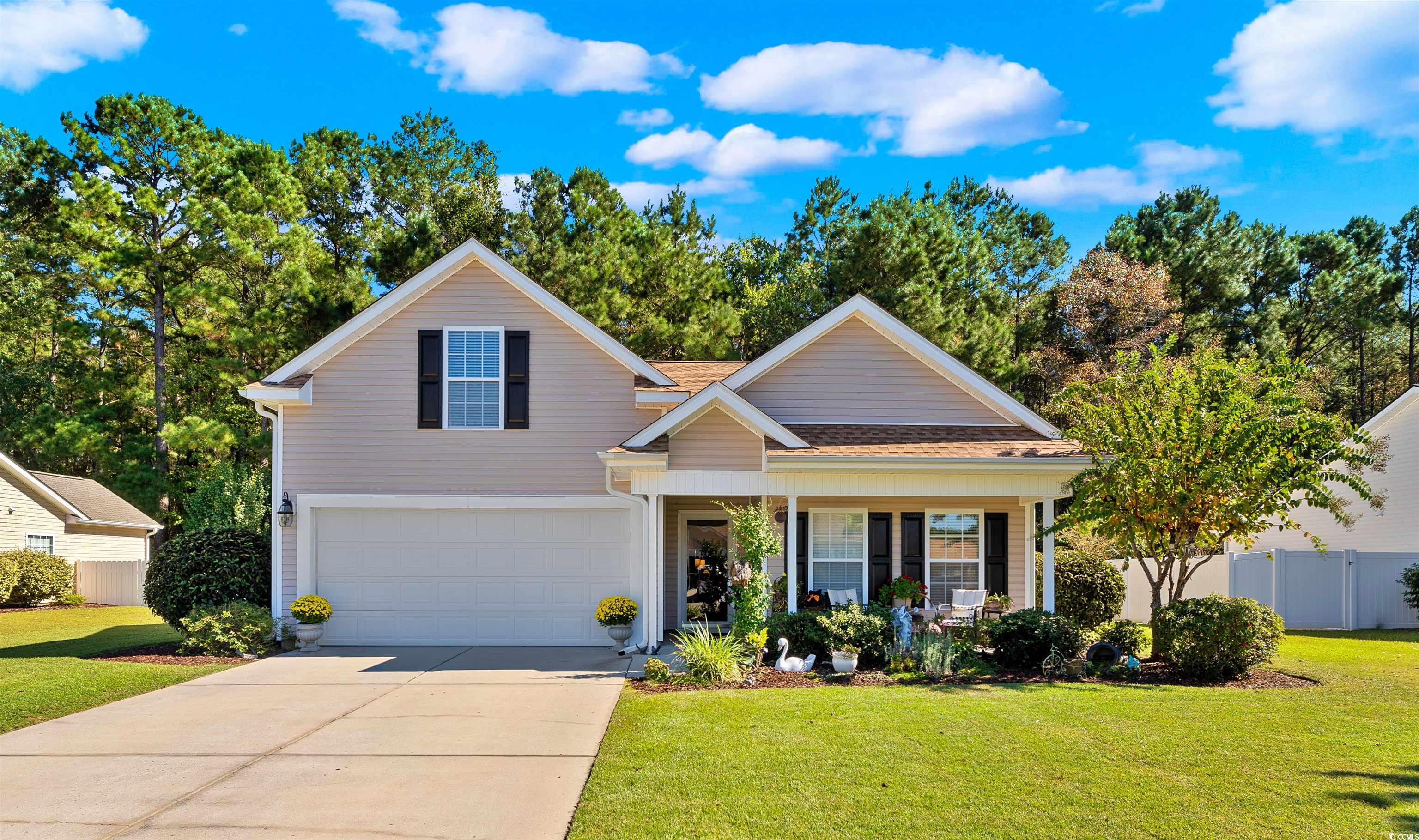 View of front of property featuring a garage and a