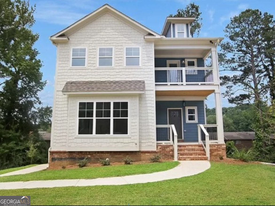 a front view of a house with a yard