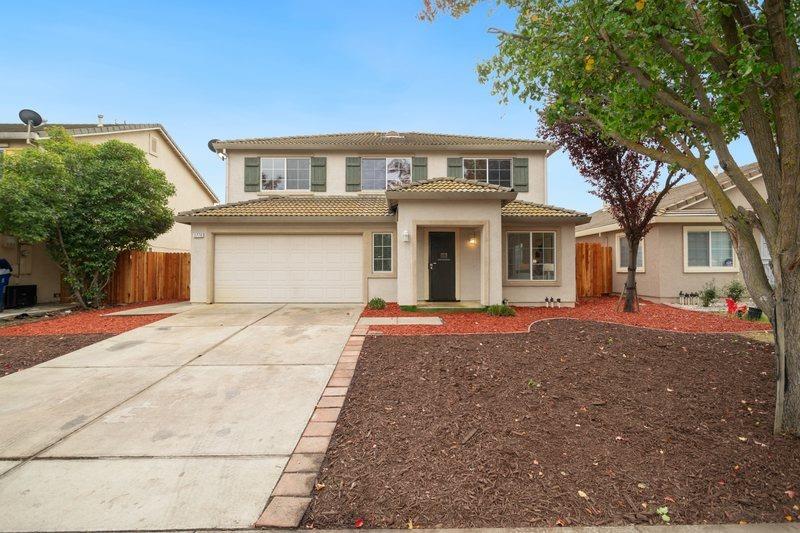 a front view of a house with yard