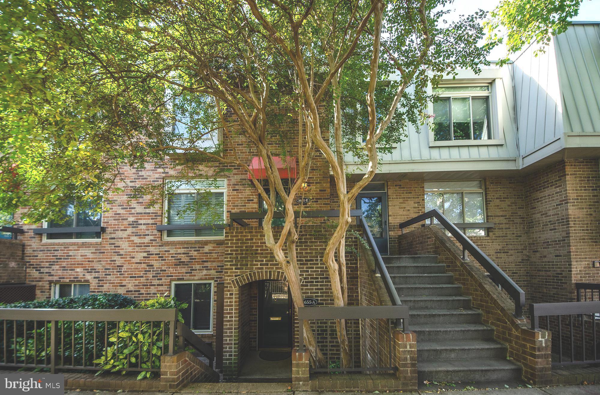 a front view of a house with stairs