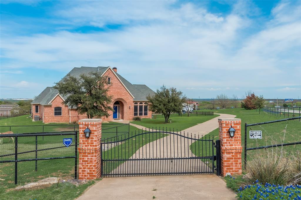 a view of a wrought iron fences in front of house