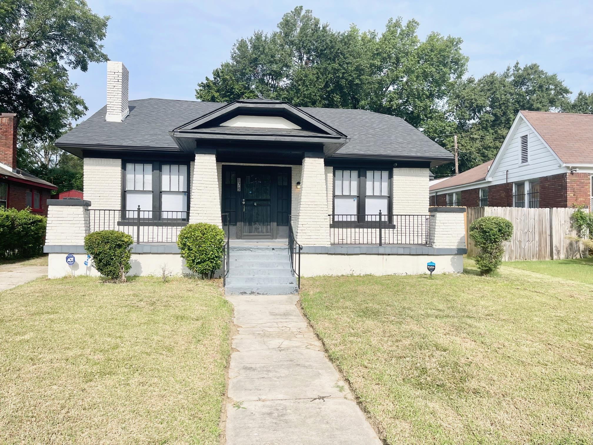 View of front of property with a front yard