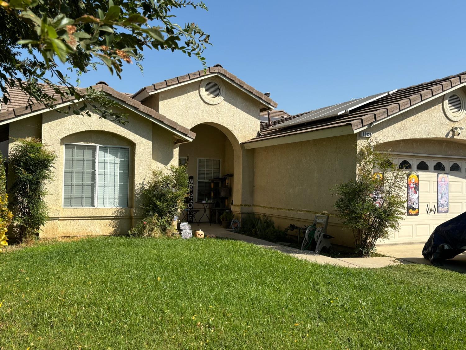 a front view of a house with a yard