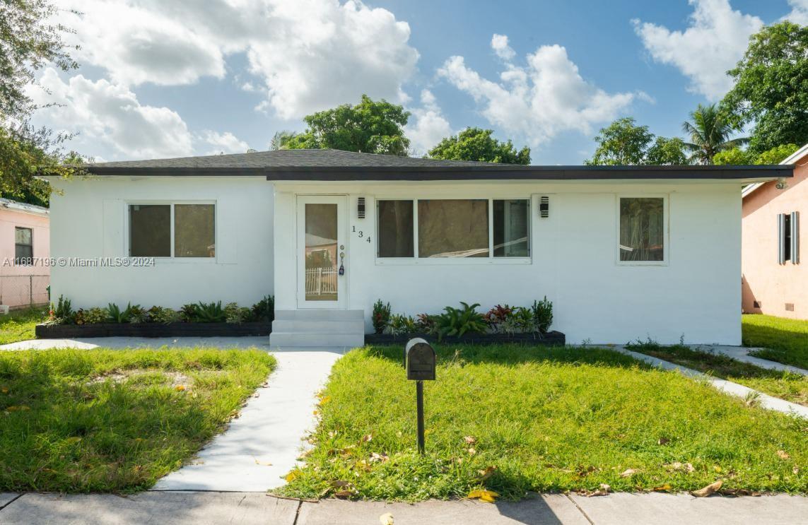 a view of a house with a yard