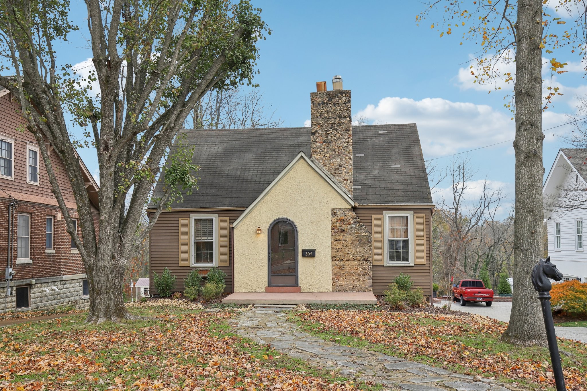 a front view of a house with a yard