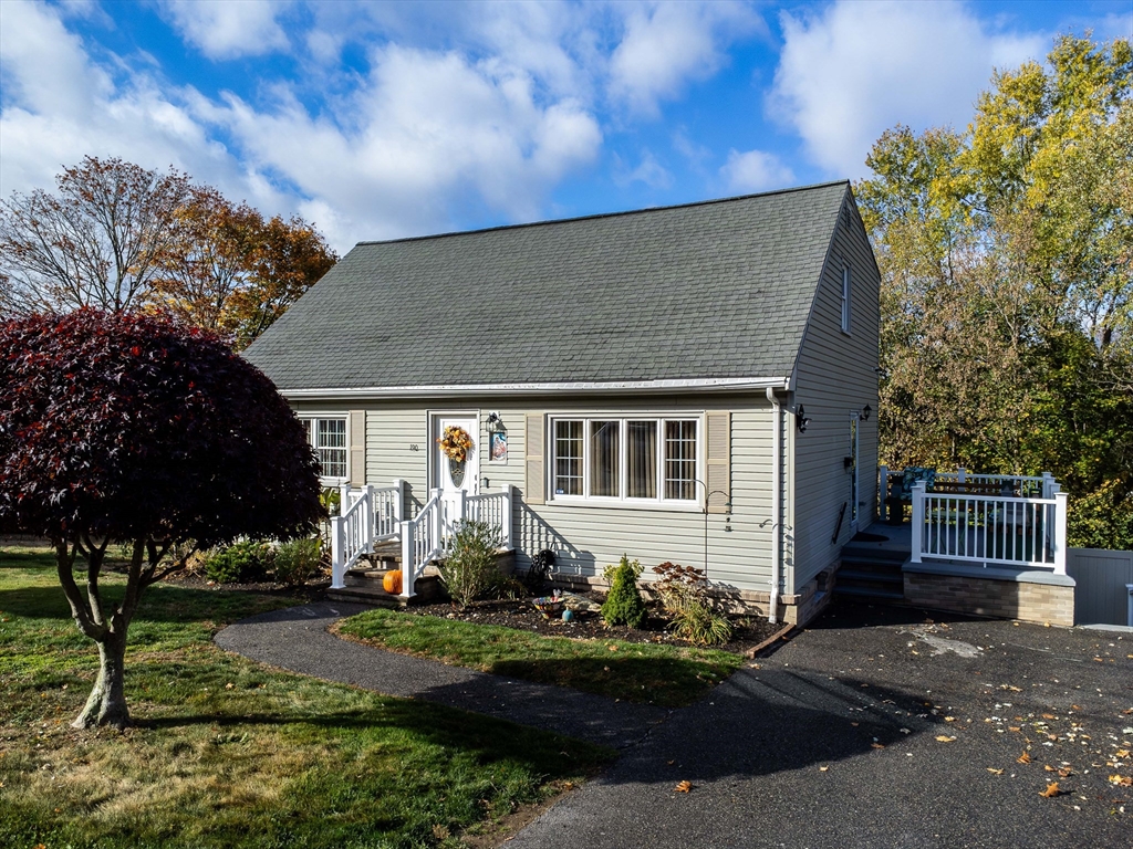 a front view of a house with a yard