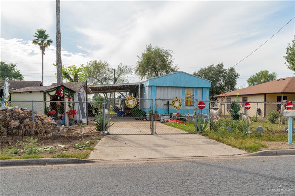 View of front of property featuring a carport