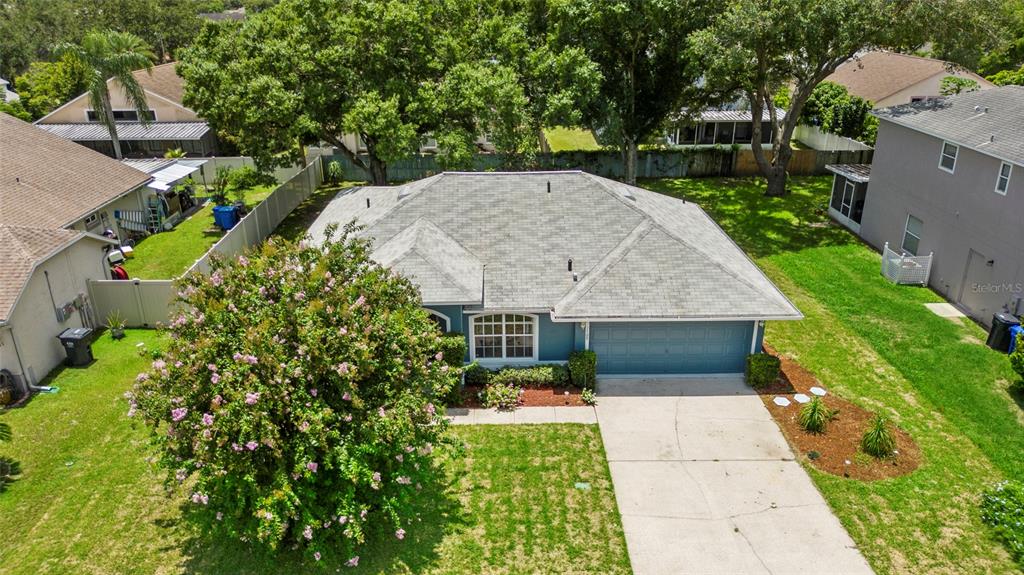 a aerial view of a house with swimming pool and garden