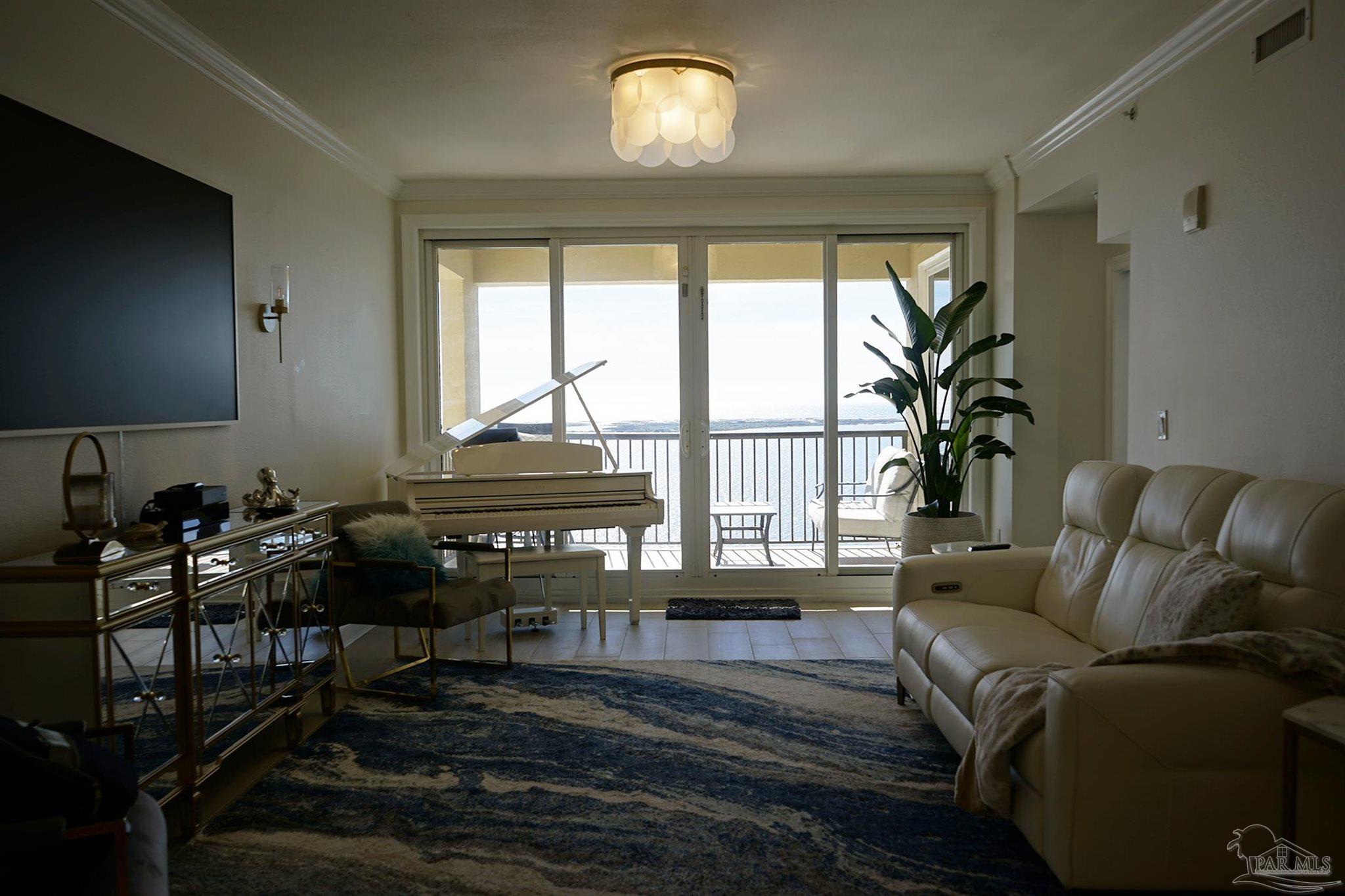 a living room with furniture and a window