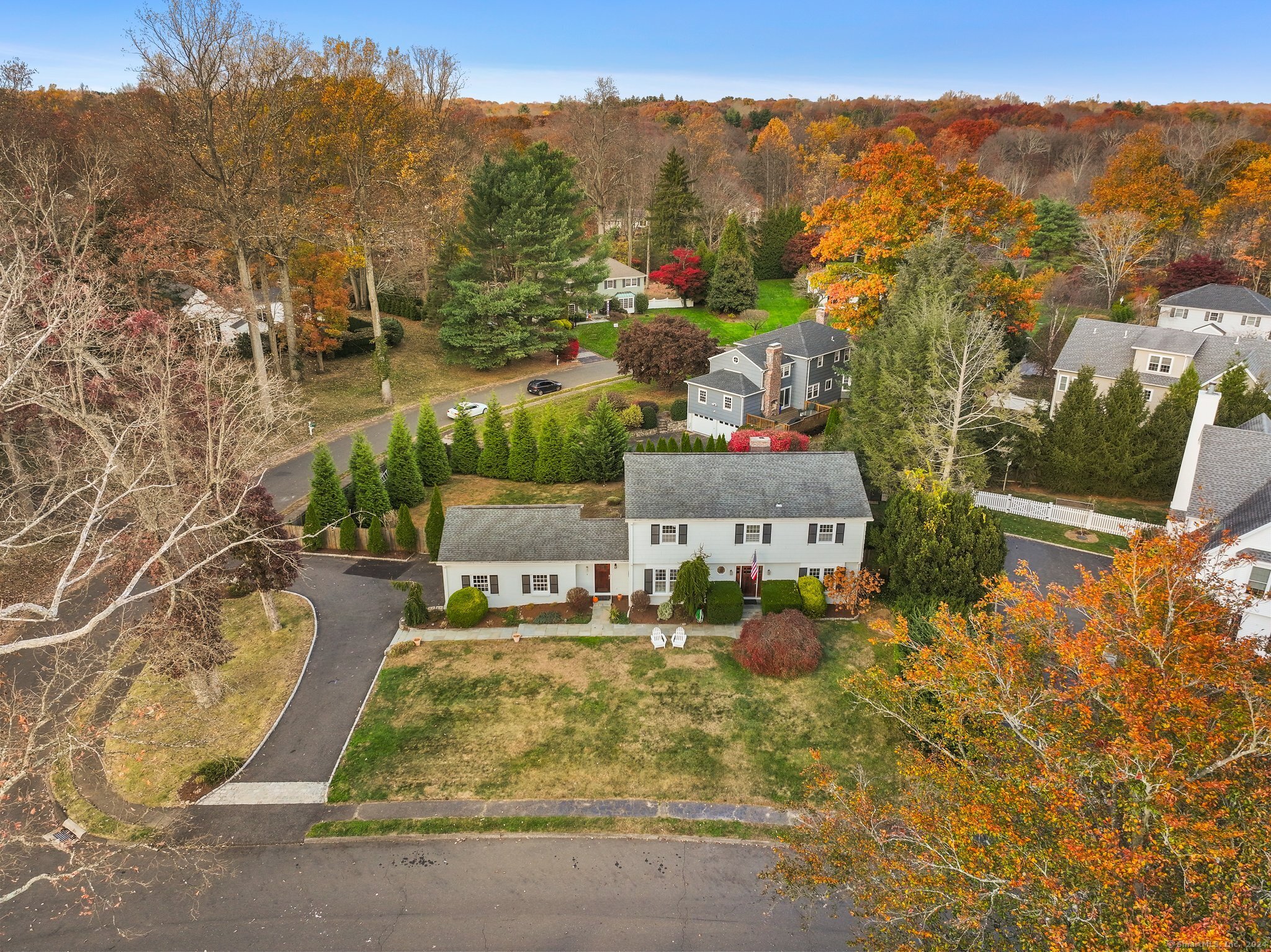 an aerial view of residential houses with outdoor space and street view