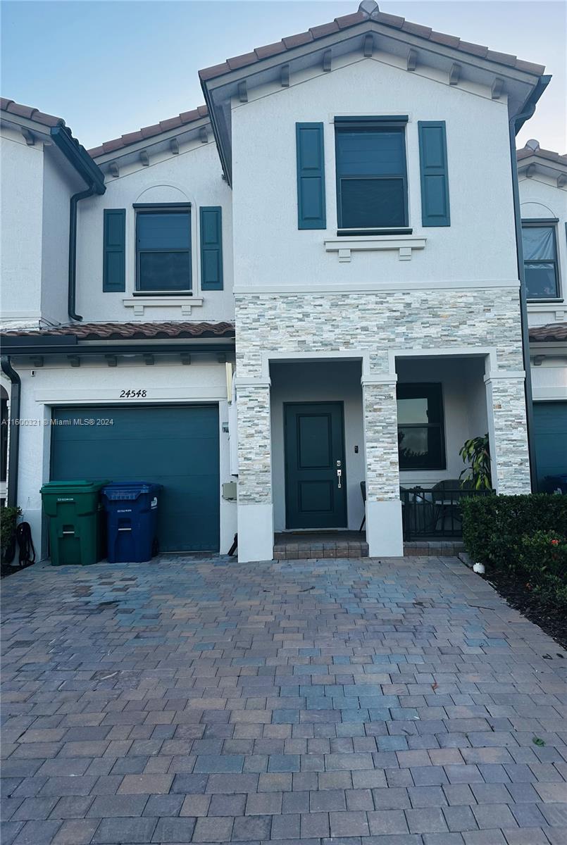 a front view of a house with yard