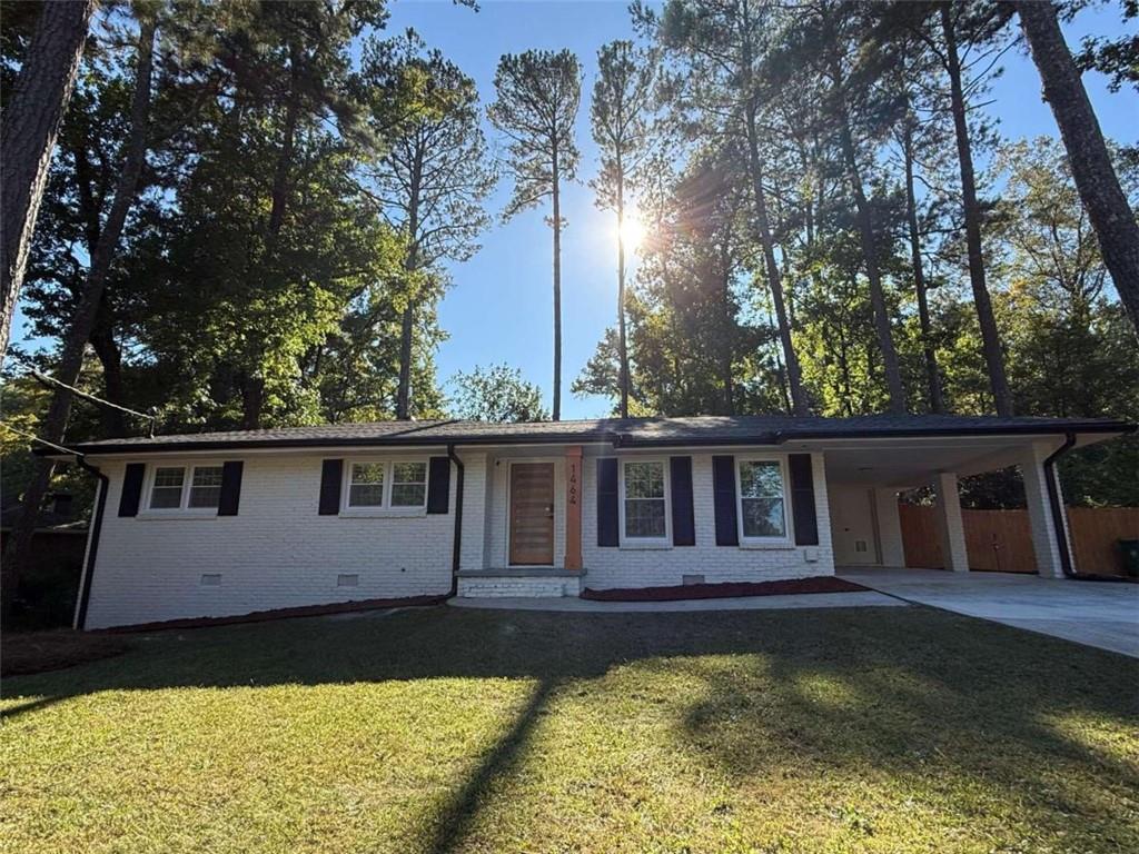 a view of a house with swimming pool next to a yard