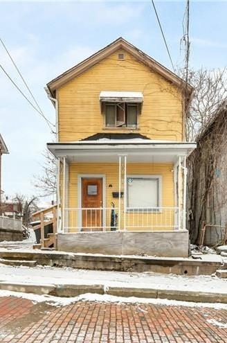 a view of a house with a street