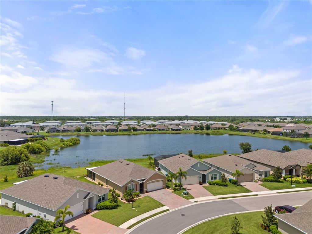 an aerial view of residential houses with outdoor space