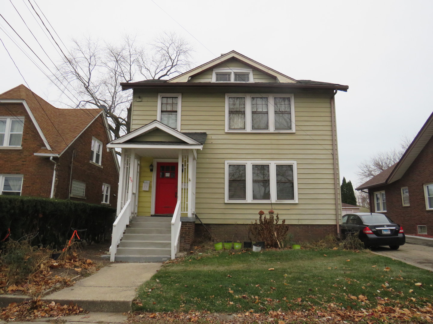 a front view of a house with a yard