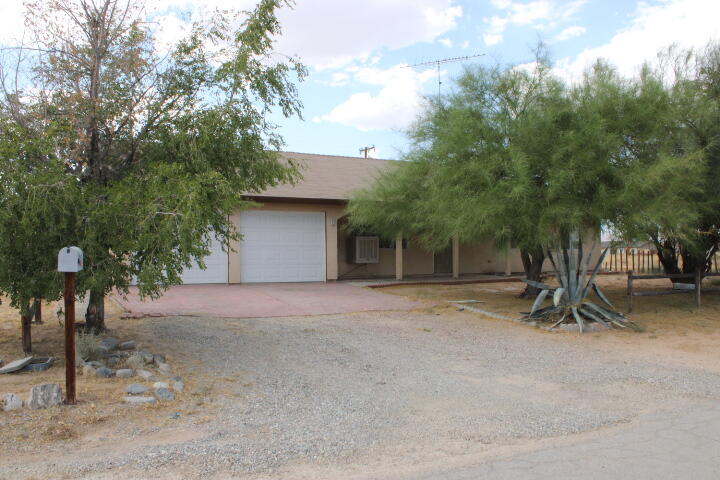 a view of a house with a tree