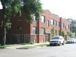 a car parked in front of a brick house