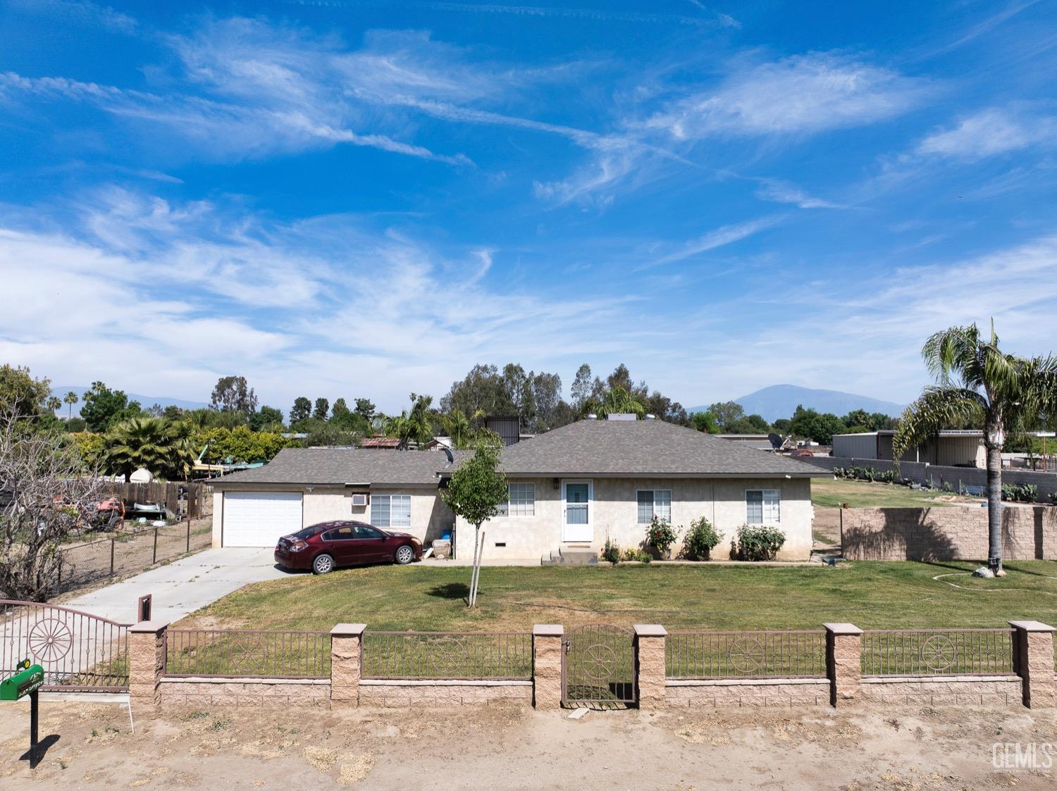 a view of a big house with a big yard