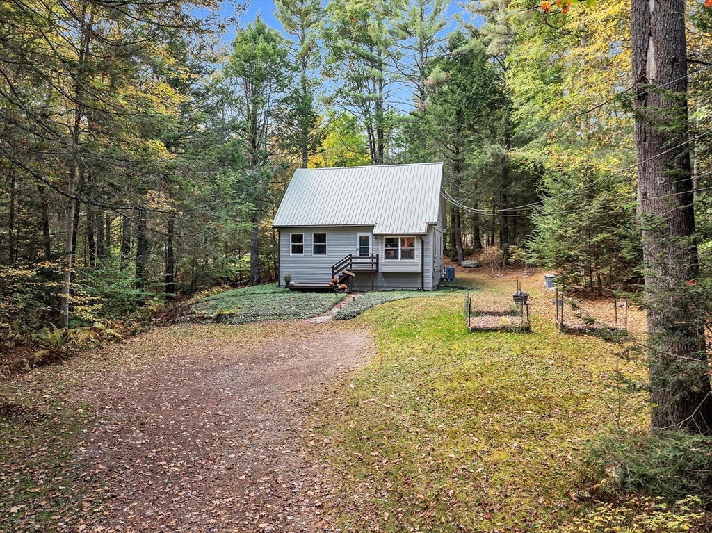 a house with trees in the background