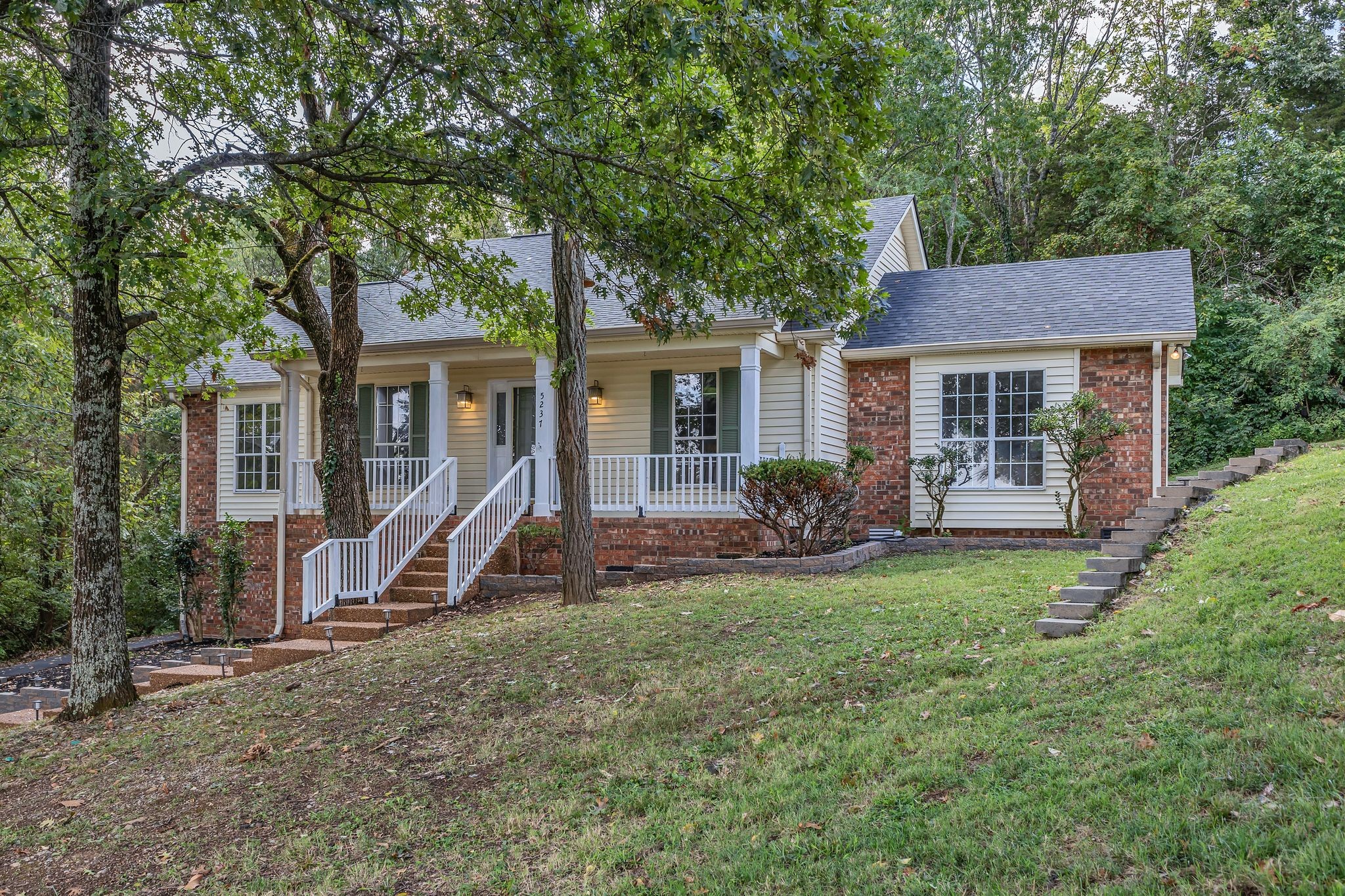 front view of a house with a yard