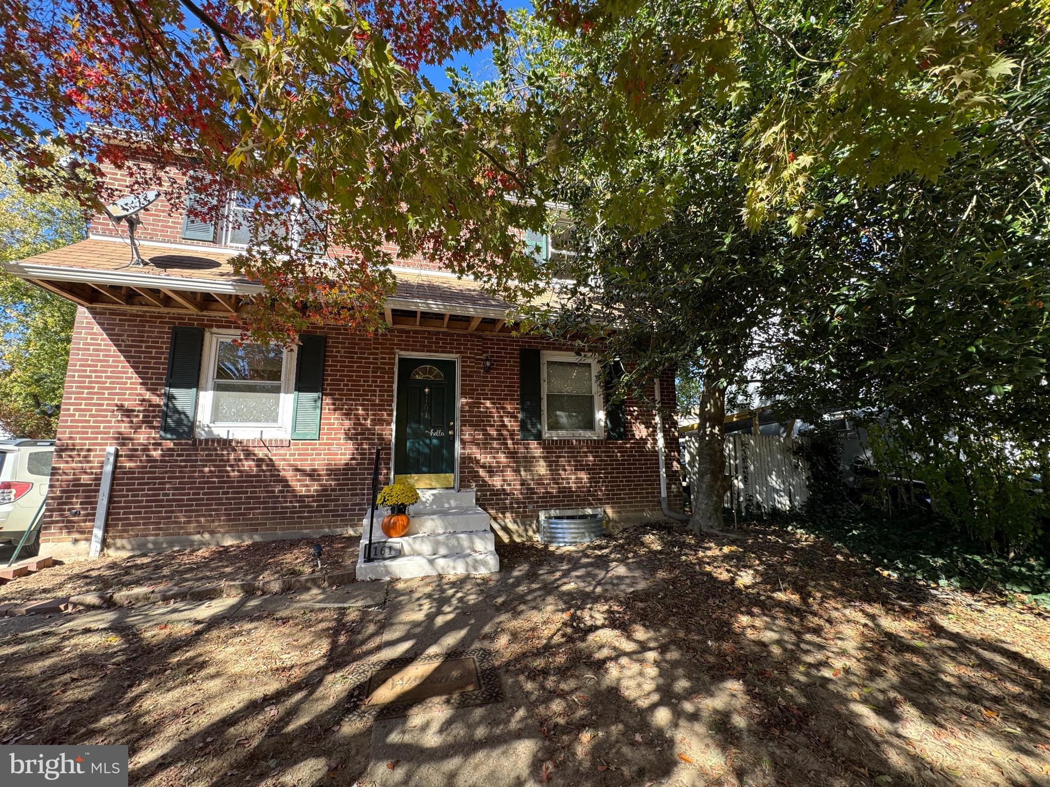 a view of a house with backyard porch and sitting area