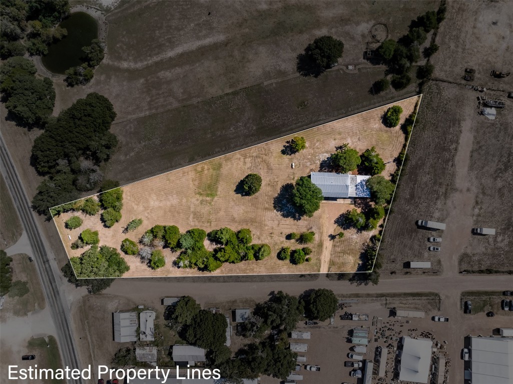 an aerial view of residential house with outdoor space