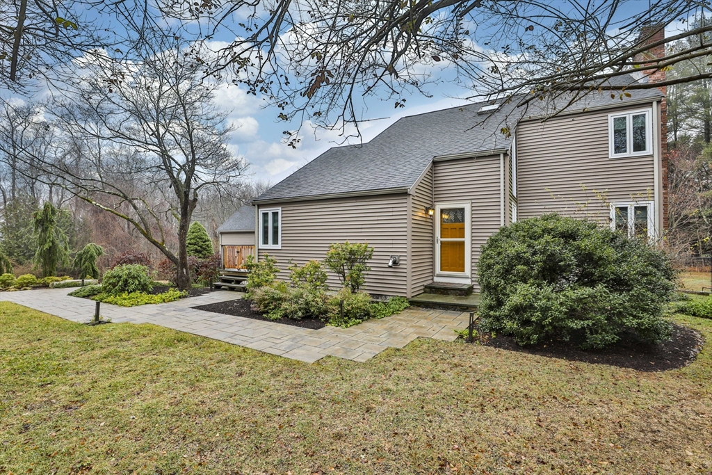 a view of a house with a yard and plants