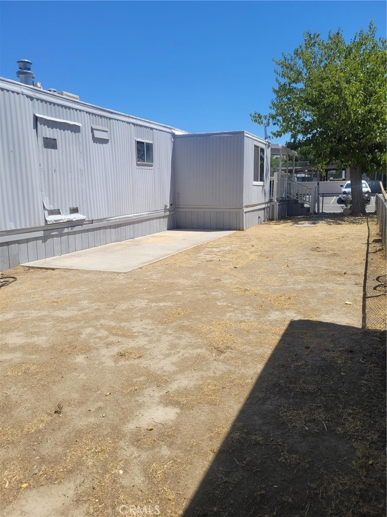 a view of a backyard of the house