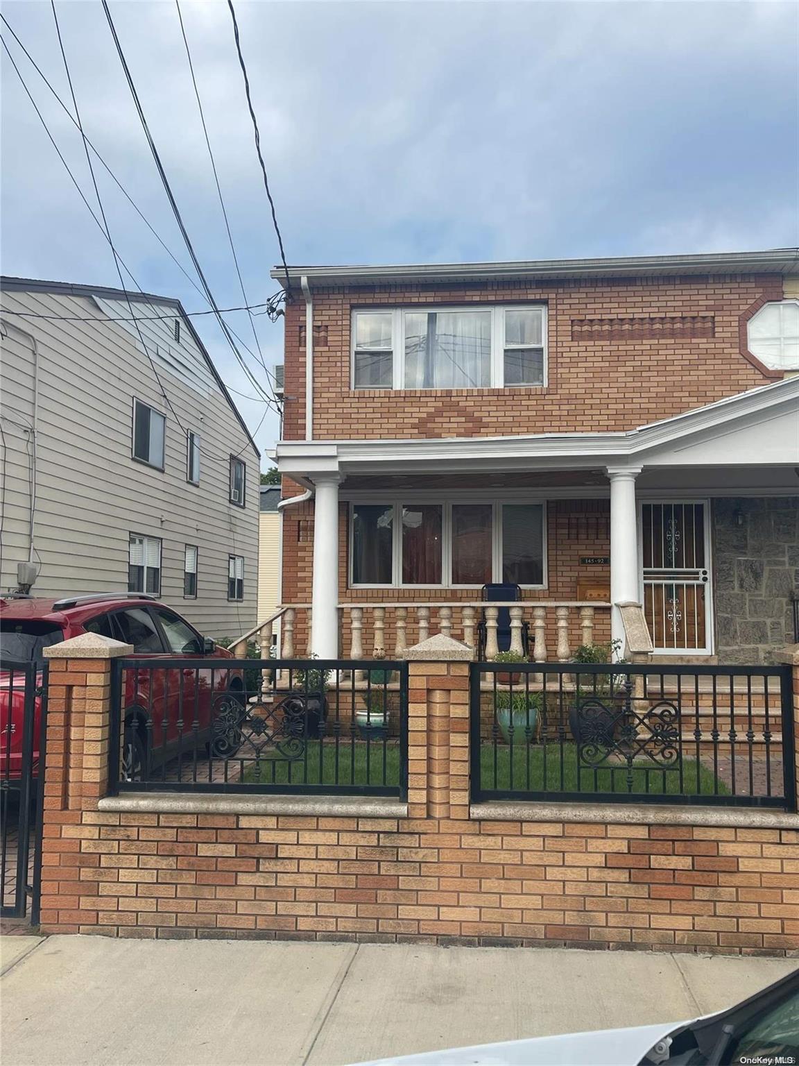 a front view of a house with lots of windows