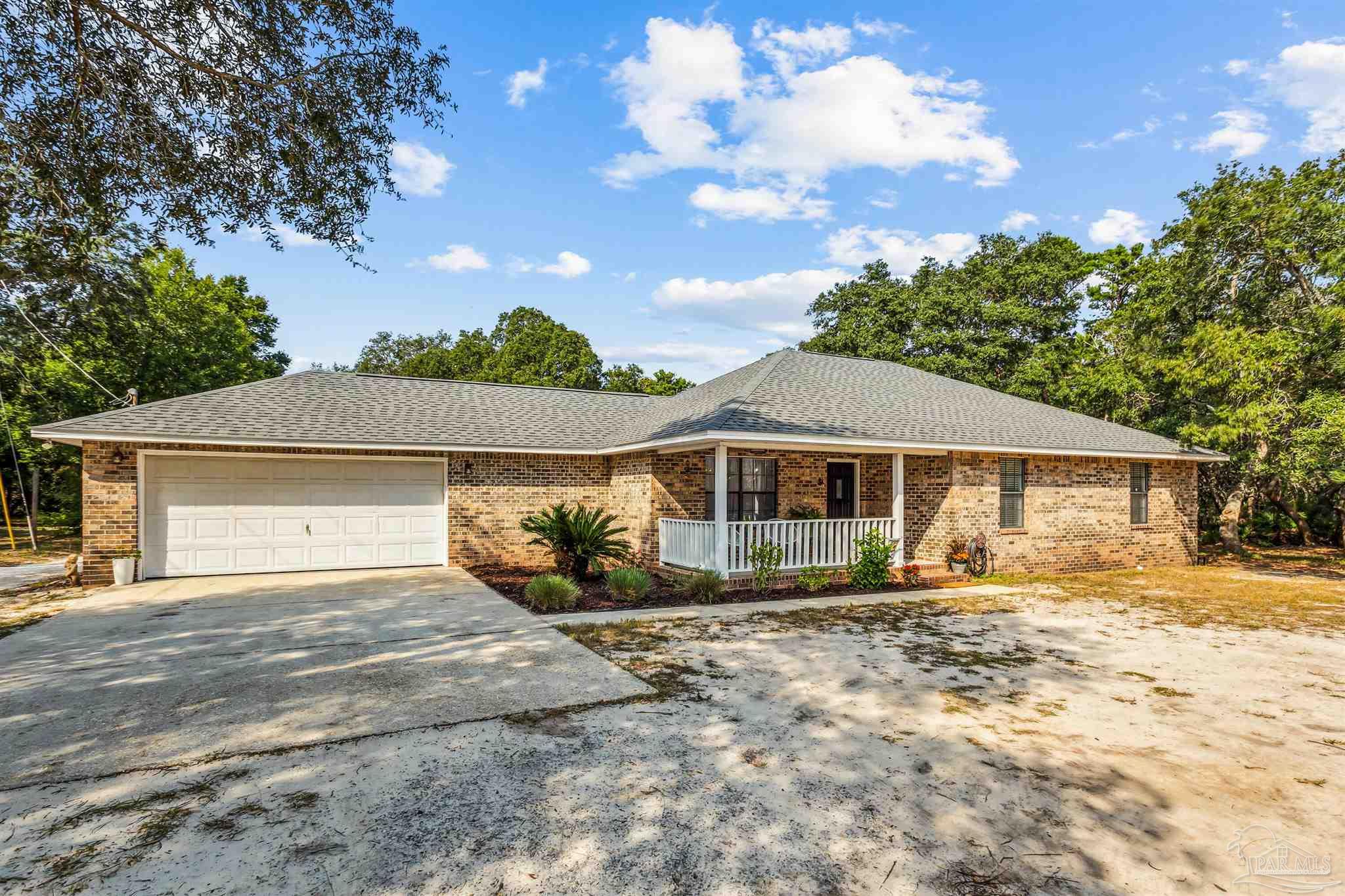 front view of a house with a yard