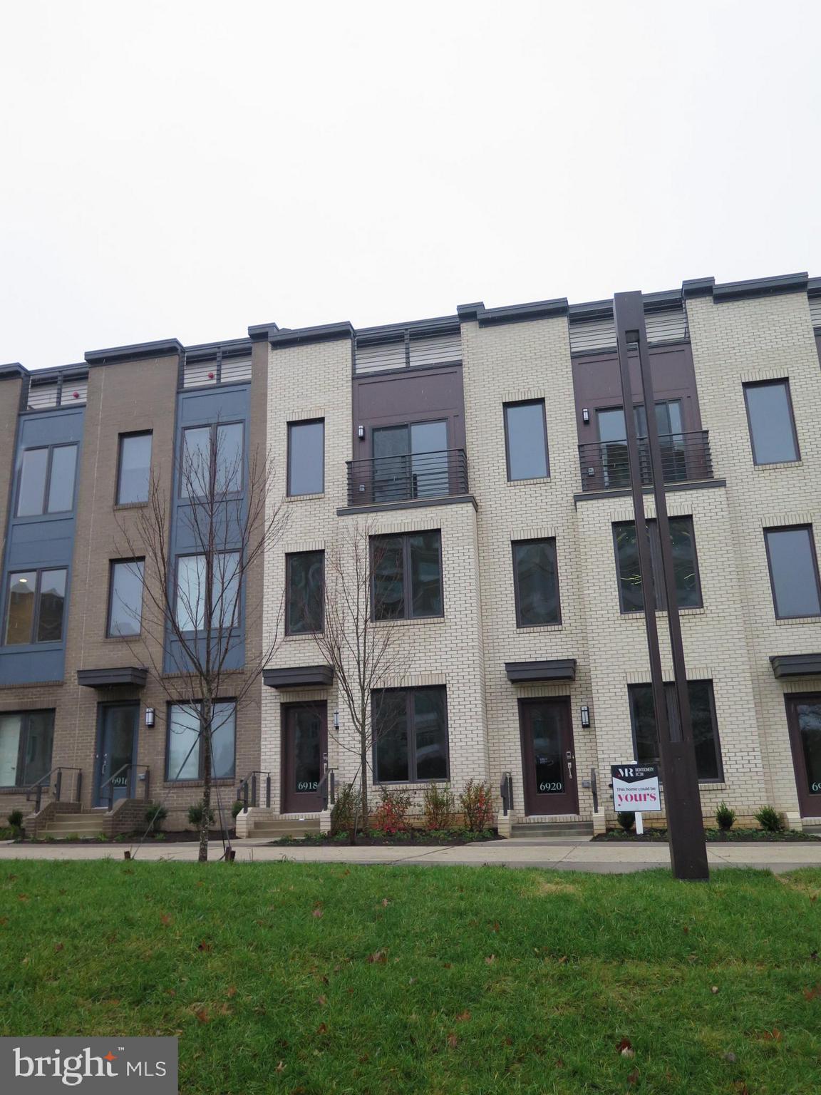 a large building with a yard in front of it