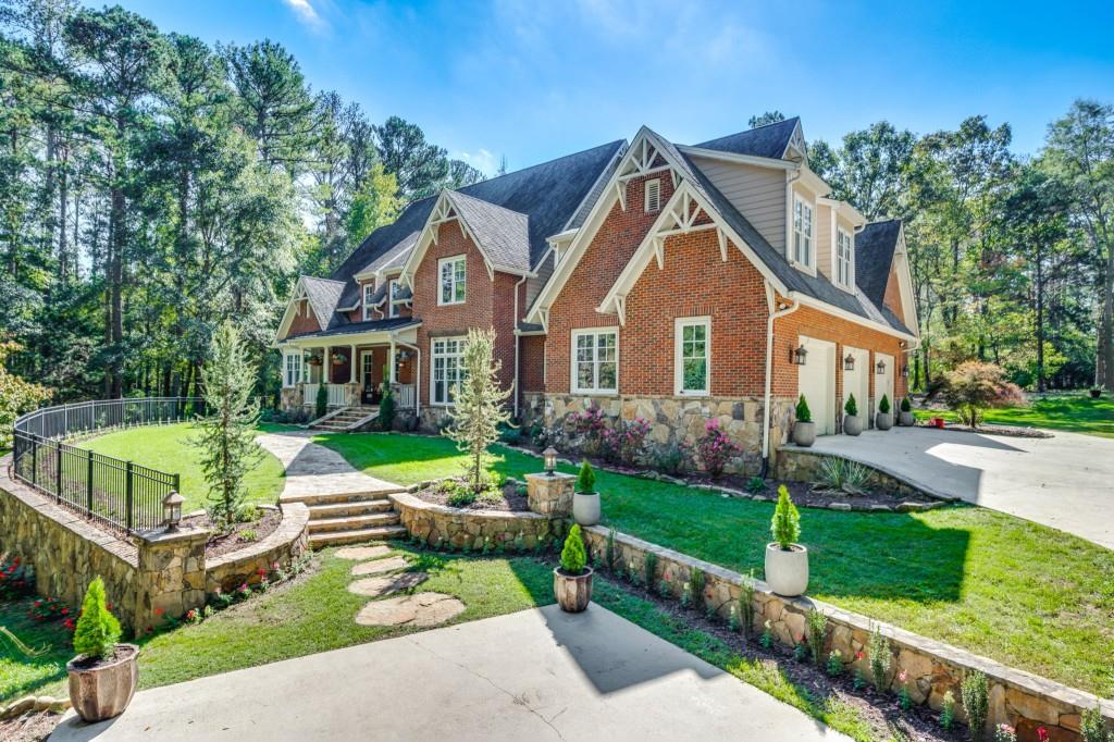 a front view of house with yard and green space