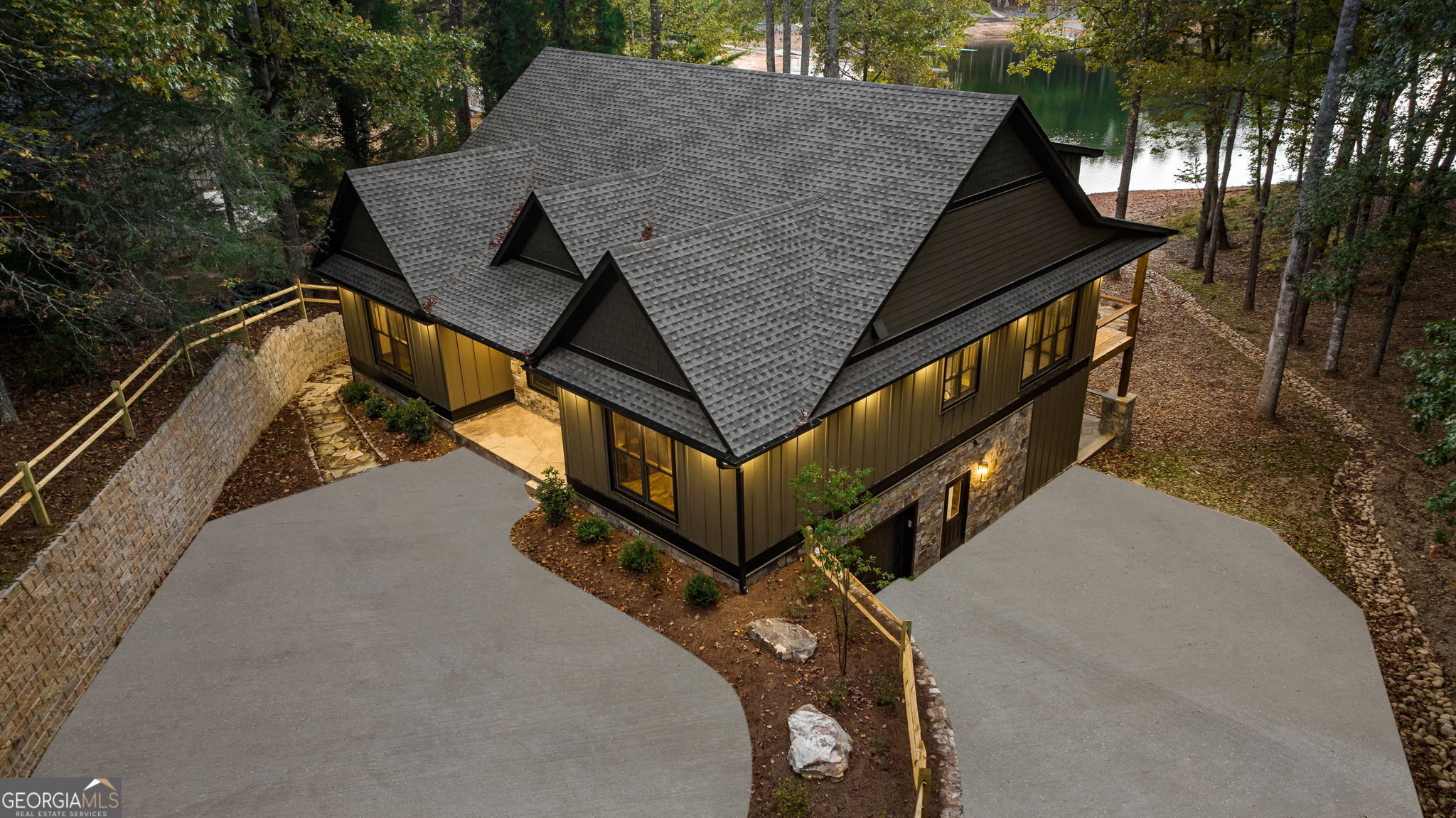 a view of a house with a wooden fence