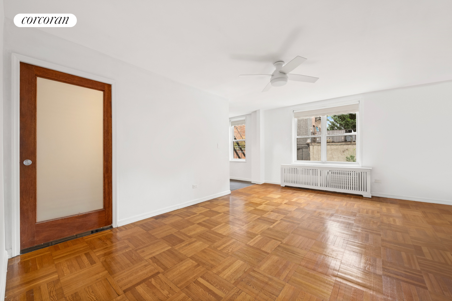 a view of an empty room with a window