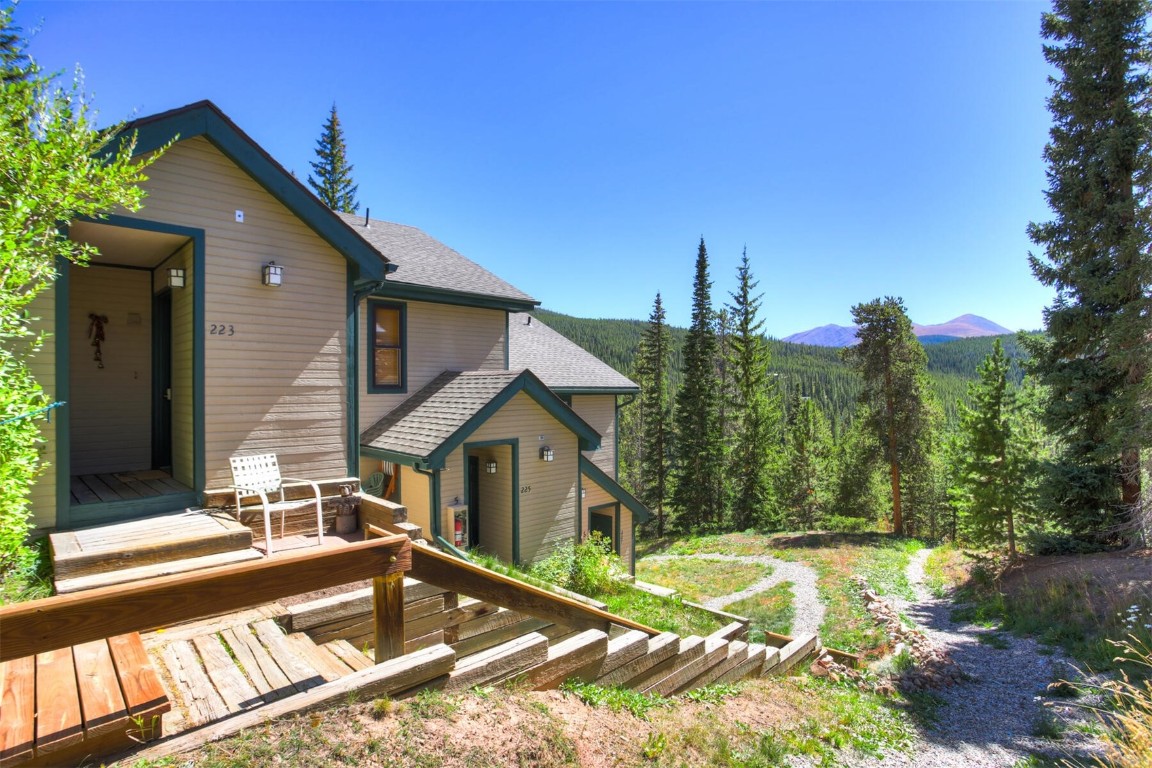 View of yard featuring a deck with mountain view