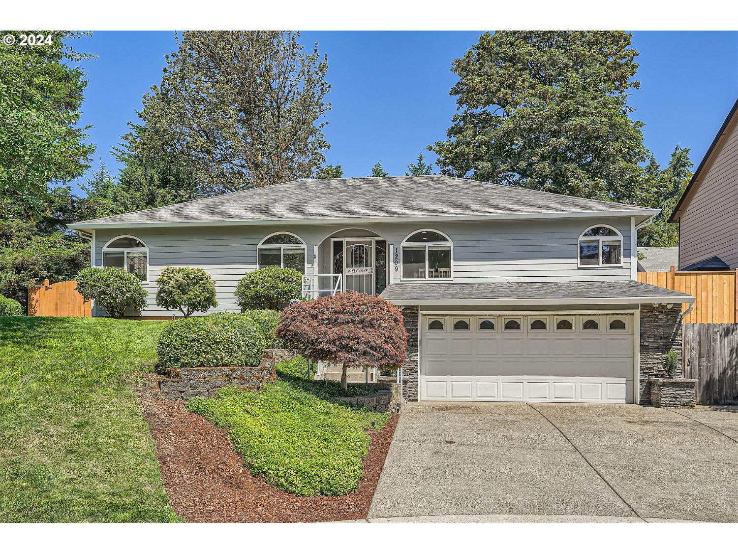 a house view with a garden space